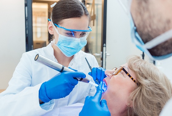 Older woman receiving essential dental care