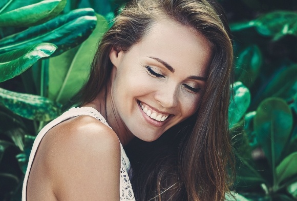 Woman smiling after tooth recontouring