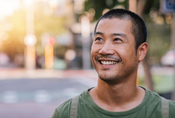 Man smiling after dental crown restoration