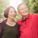Older couple enjoying the long term benefits of dental implants