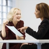 Dental team member and patient discussing dental insurance coverage