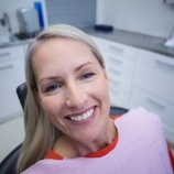 Woman smiling during dental checkup