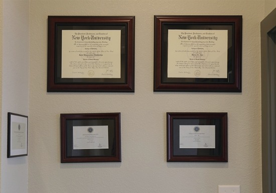 Dentist diplomas on dental office wall