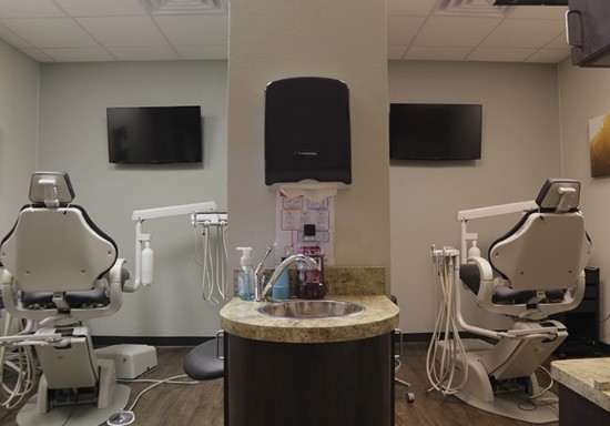 Hallway looking into two side by side dental treatment rooms