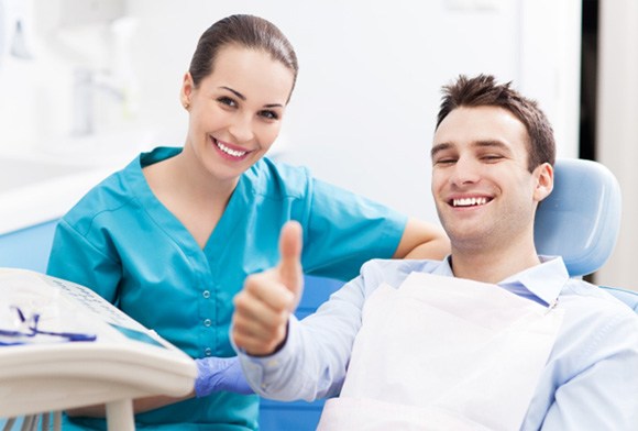 thumbs up after learning about the dental membership plan in Carrollton