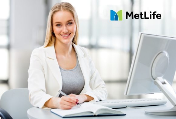 Woman smiling with MetLife logo in background