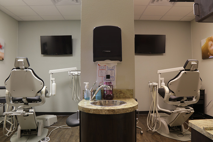 Hallway looking into two side by side dental treatment rooms