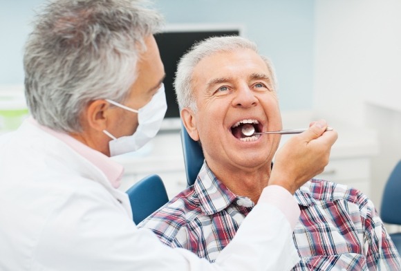 Man receiving oral cancer screening