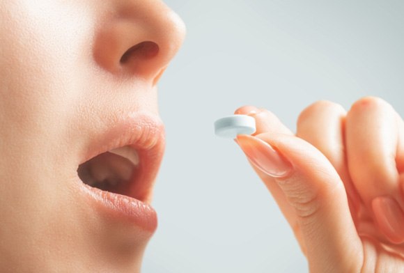 closeup of patient taking oral conscious sedation in Carrollton 