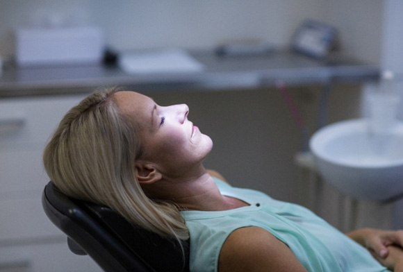 clpatient relaxing in dental chair with oral conscious sedation in Carrollton 