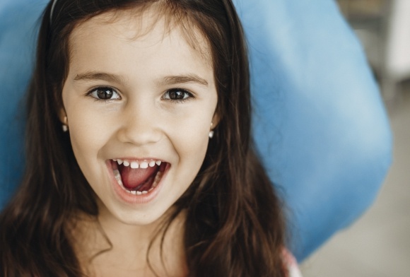 Child smiling after receiving dental sealants