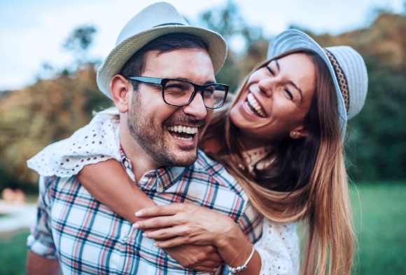 Man and woman smiling after pocket irrigation treatment