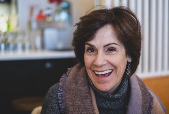 Woman smiling after treatment for cracked teeth syndrome