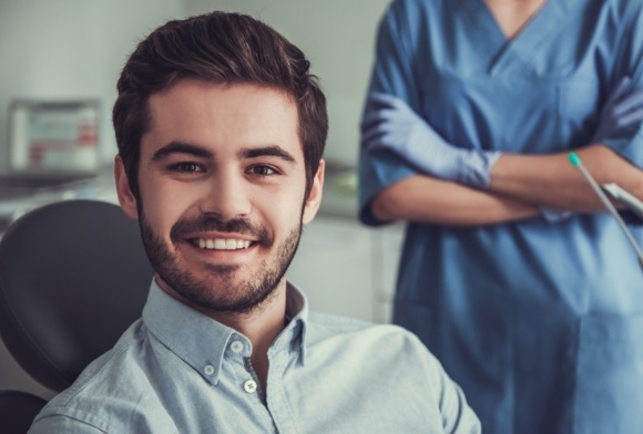 Man smiling after root canal therapy