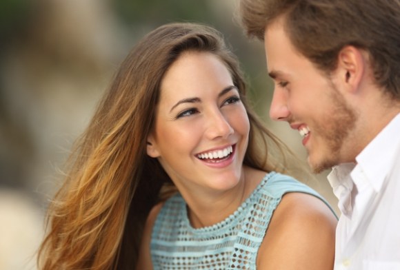 Woman with gorgeous smile after porcelain veneers