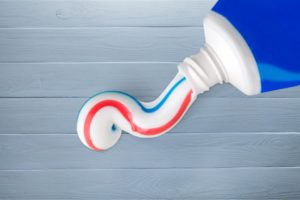 An open tube of toothpaste.