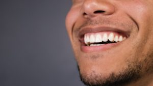 Man showing healthy gums.