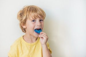 little boy with dental mouthguard