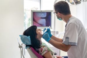 Carrollton dentist using intraoral camera during dental checkup