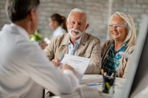 senior couple at a consultation for dental implants 