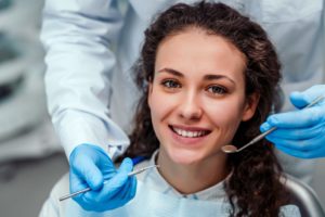 young woman visiting her dentist to get fillings 