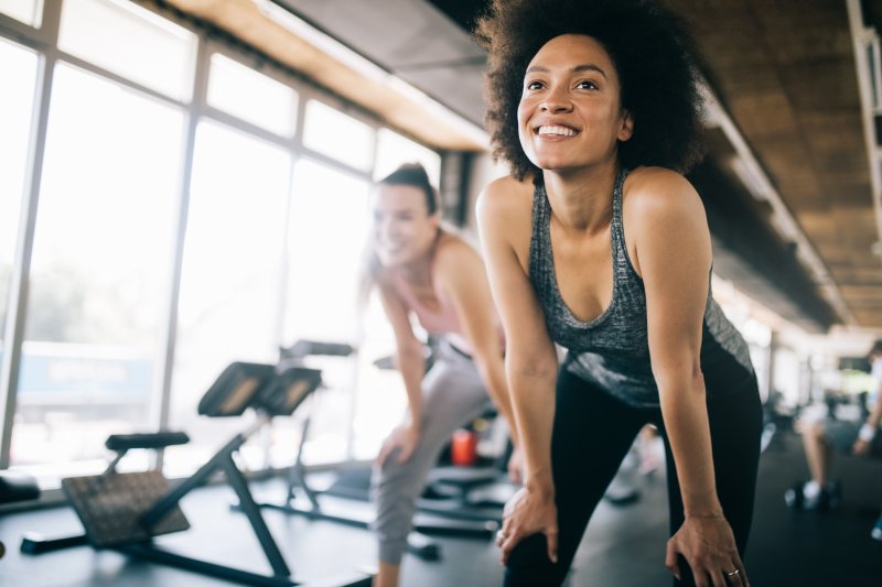 woman smiling while exercising