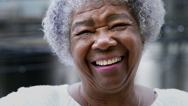 older person who got dental implants after menopause smiling